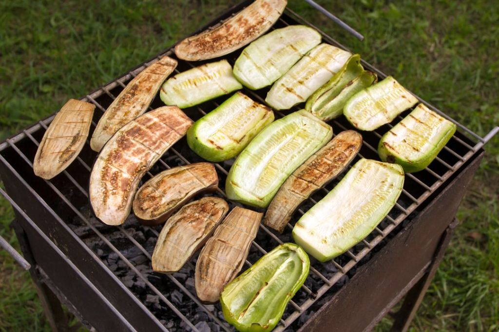 Grilled vegetables cooking over a barbecue