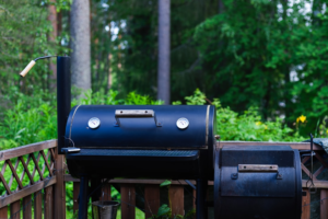 Charcoal barbecue smoker in a backyard cooking area