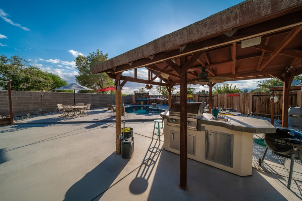 Gas grill on a covered backyard patio