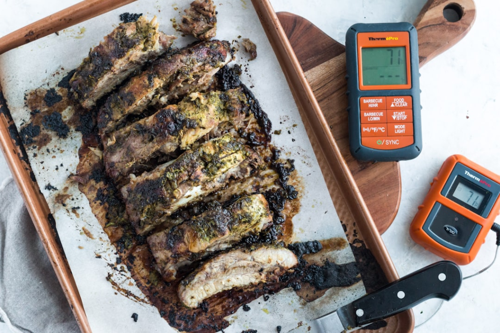 Meat thermometer used while grilling barbecue ribs