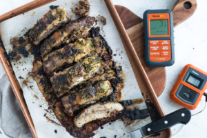 Meat thermometer used while grilling barbecue ribs
