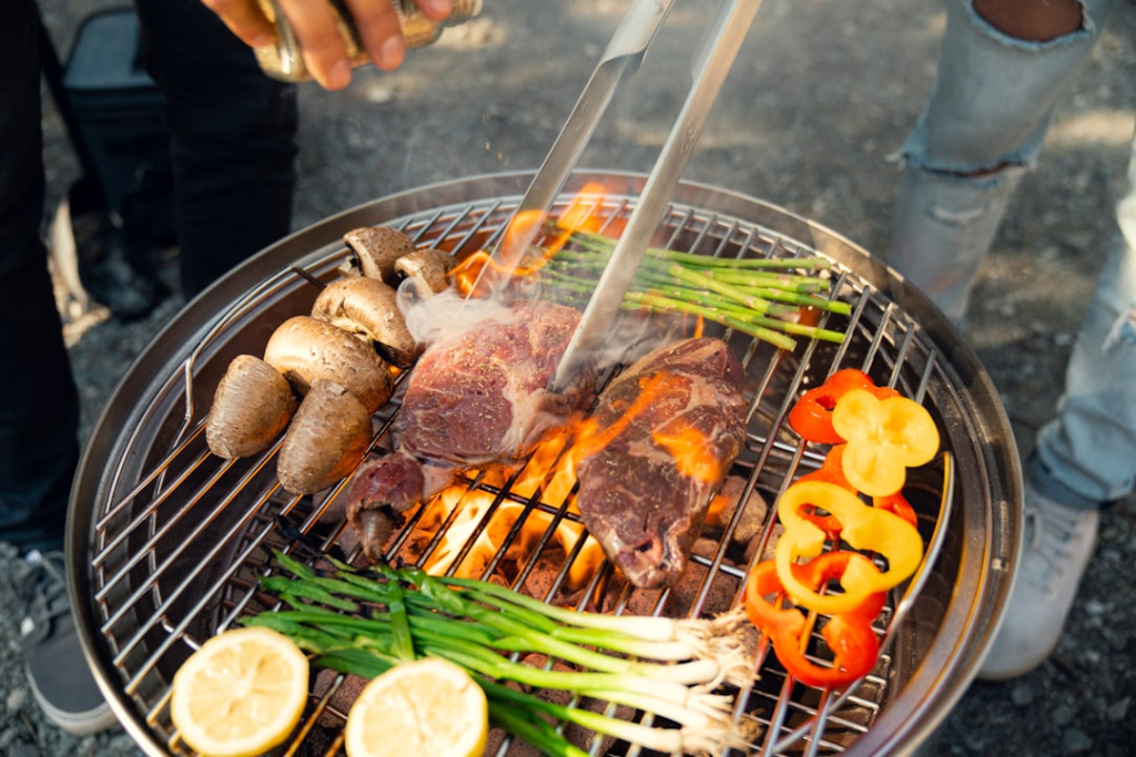Portable grill being used at an outdoor campsite