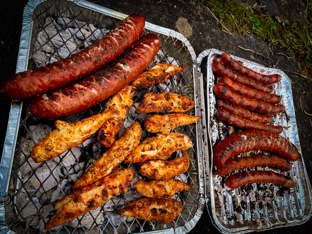 Chicken cooking on an outdoor barbecue grill