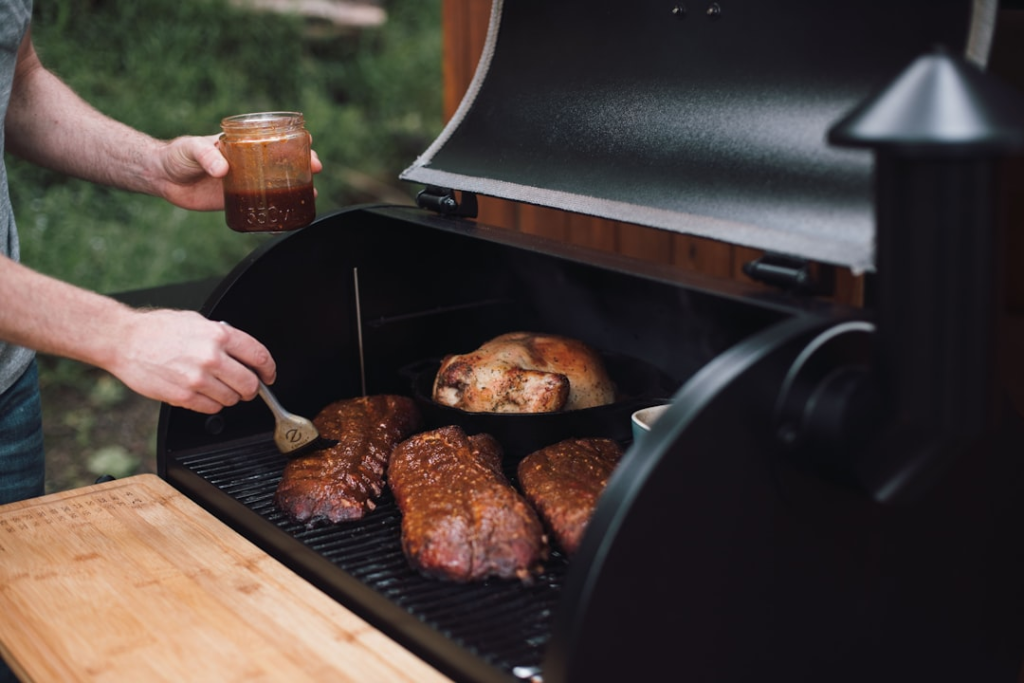 Barbecue ribs cooking in a pellet smoker outdoors