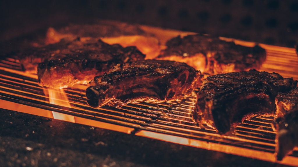 Charcoal grill arranged for direct and indirect heat cooking